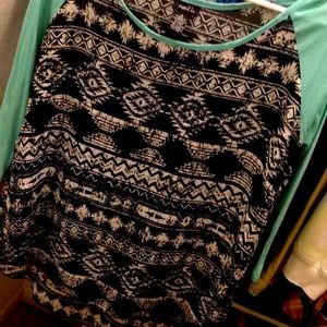 Quarter sleeve. Longer in the back. Medium